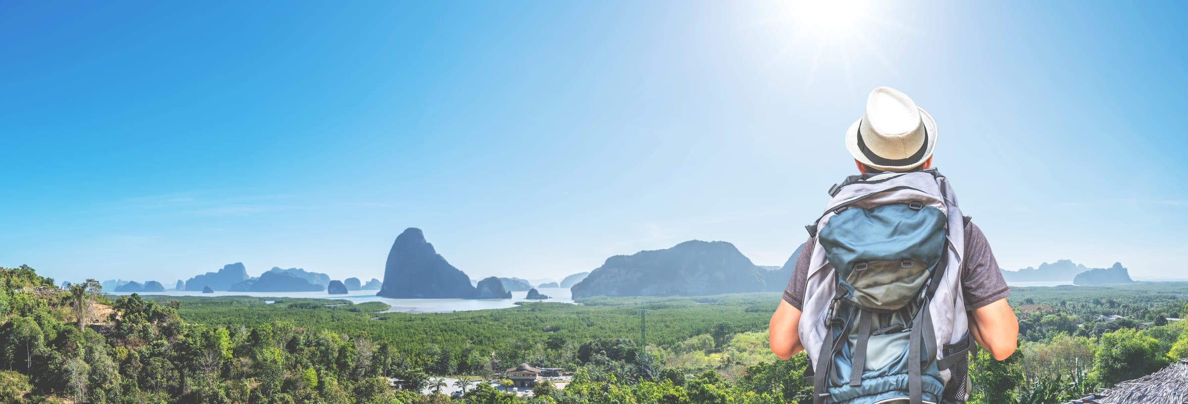 Backpacker taking in a mountain viewpoint