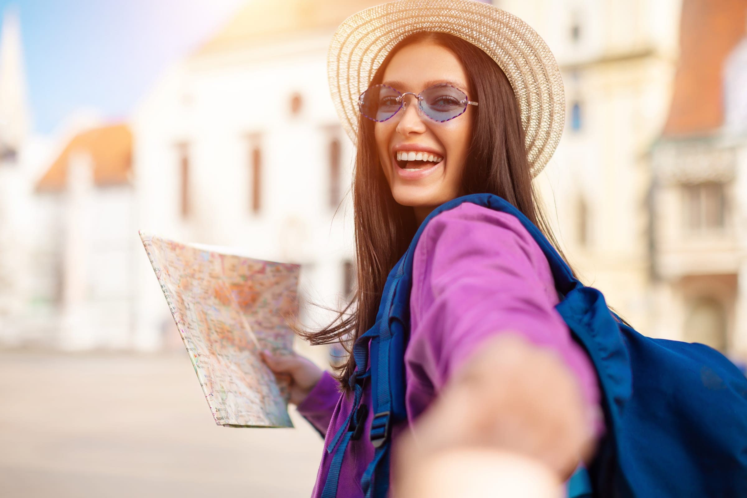 Traveler reading a map in a historic city